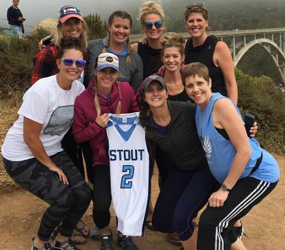 UW-Stout alumni with Amanda Geissler's basketball jersey.