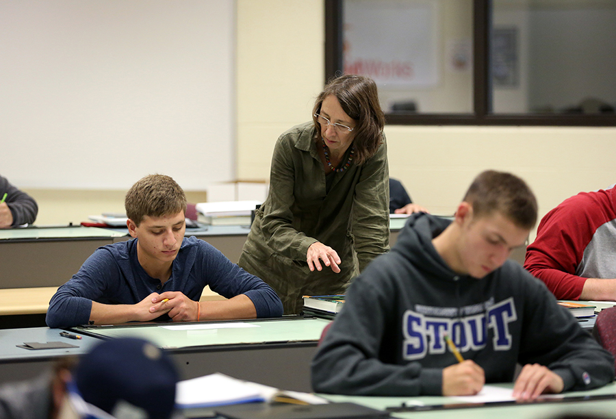 Monika Herrmann, one of the book authors, works with students in her Engineering Graphics Fundamentals class.