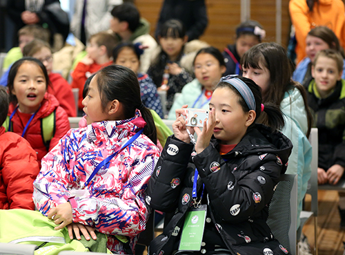 Chinese students take pictures during their visit to UW-Stout