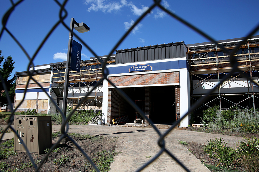 A construction fence stands in front of Merle M. Price Commons, the first floor of which is being renovated.