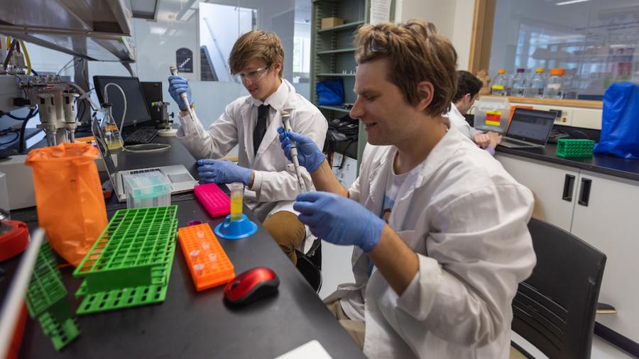 ABMB students Tanner Thompson and Joshua Rusnak extract DNA from E. coli.