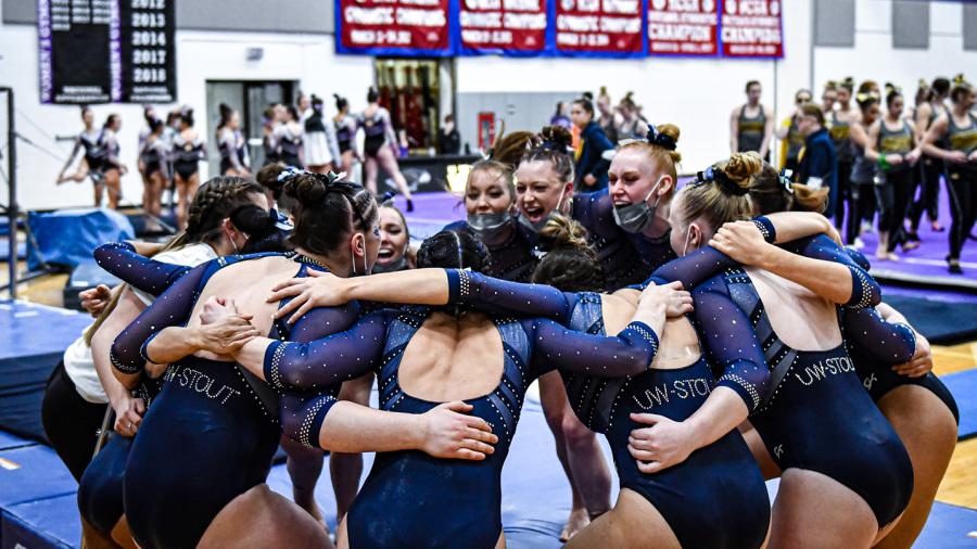 UW-Stout gymnasts huddle at their recent conference meet.