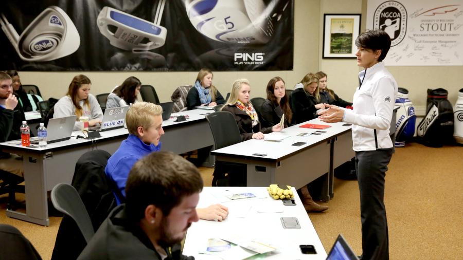 Professor Kris Schoonover teaches in a golf enterprise management class.