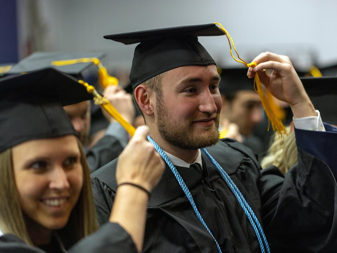 Bachelor degree graduates move the tassels on their mortarboards from the right to the left as part of the tradition to signify they have earned their degree.